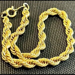 Rope gold tone bracelet.